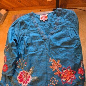 bright blue long sleeve top with colorful embroired flowers by Johnny Was